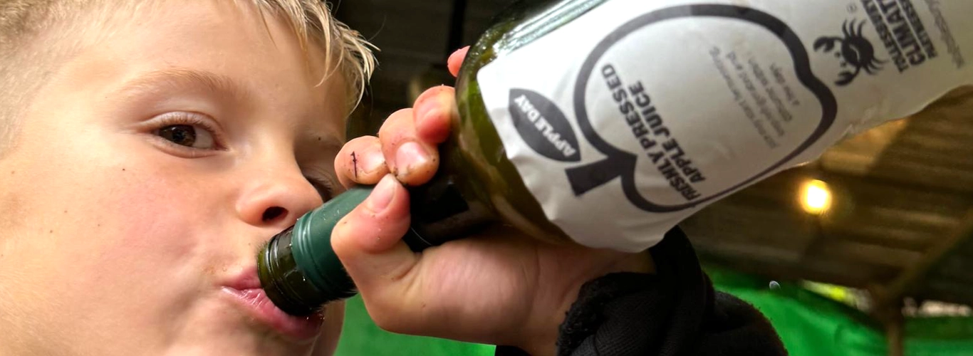 Taking a swig of freshly pressed apple juice, TCP Tollesbury